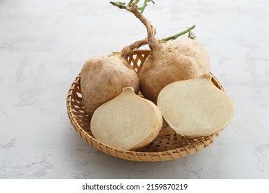 Fresh Jicama or bengkoang, white tubers that can be eaten as salad or for face masks. Served in rattan basket.

