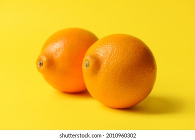 Fresh juicy oranges on color background. Erotic and female health care concept