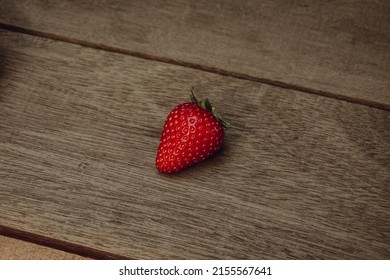 Fresh juicy premium strawberries on natural wooden background. Tochiotome Japanese strawberry.