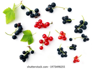 Fresh juicy red and black currants isolated on a white background - Shutterstock ID 1973498255