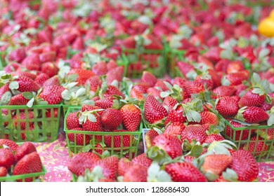 Fresh and juicy strawberries for sale at the market. Horizontal Shot.