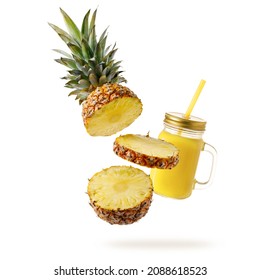 Fresh juicy tropical fruit pineapple  and smoothie glass jar flying isolated on white background. Sliced ananas pineapple and juice  falling.