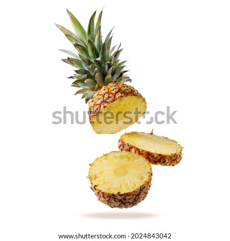 Fresh juicy tropical fruit pineapple flying isolated on white background. Sliced ananas pineapple falling.