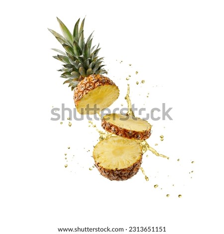 Fresh juicy tropical fruit pineapple with splashing drink flying isolated on white background. Sliced ananas pineapple with drops of juice falling. 