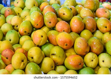 Fresh Juicy Tropical Mangoes In A Market, Close Up.