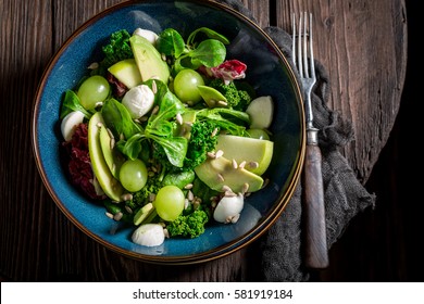 Fresh Kale Salad With Mix Of Vegetables And Avocado