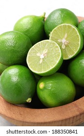 Fresh Key Limes In Wooden Bowl