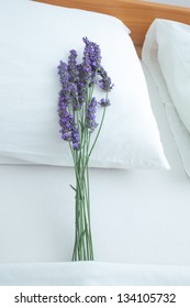 Fresh Lavender On Bed Pillow In Bedroom Interior