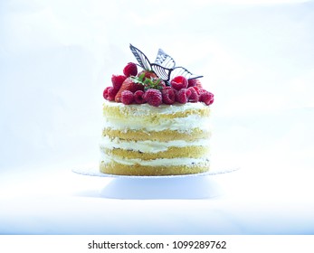 Fresh layered cake, without ointment. isolated on a white background. Upper fruit for decoration
