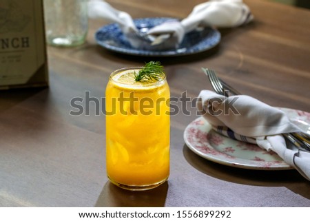 fresh lemon alcohol cocktail at a restaurant interior 
