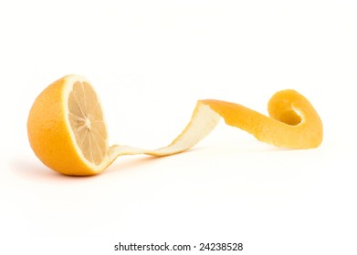 Fresh Lemon With Cut Long Peel On Isolated White Background, Focus At Center Of The Lemon