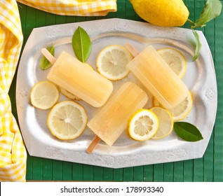 Fresh Lemon Popsicles On Slices Of Organic Lemons