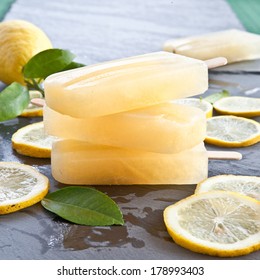 Fresh Lemon Popsicles On Slices Of Organic Lemons