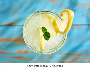 fresh lemonade with mint shot top down on rustic table
