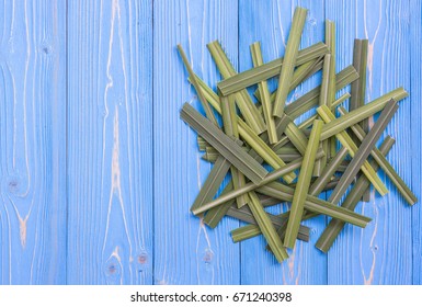 Fresh Lemongrass Or Citronella Grass Leaf On Blue Wooden Texture