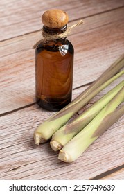 Fresh Lemongrass Leaves With Essential Oil Bottle On Table Lemongrass Is A Tropical, Grassy Plant Used In Cooking And Herbal Medicine. Extracted From The Leaves And Stalks, Citrus Scent.