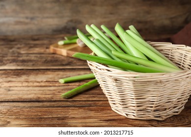 Fresh Lemongrass In Wicker Bowl On Wooden Table, Space For Text