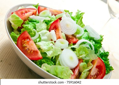 Fresh Lettuce And Tomato Salad On Bowl