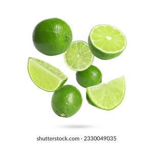 Fresh lime fruits falling on white background - Shutterstock ID 2330049035