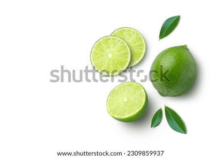 Fresh lime with half sliced and green leaves isolated on white background, top view, flat lay.