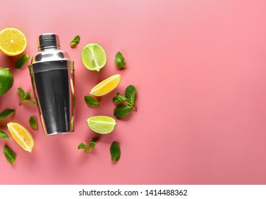 Fresh Lime, Lemon, Shaker And Mint Leaves On Color Background