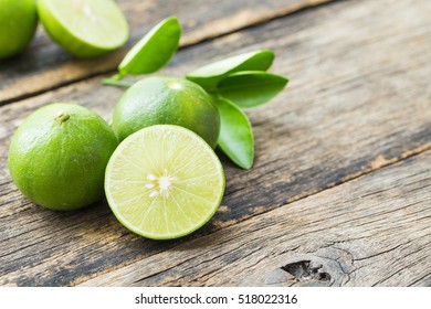 Fresh Limes On Old Wooden Table.