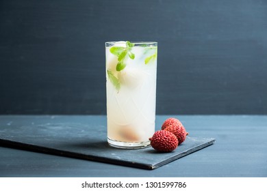 Fresh lychee mojito on the rustic background. Selective focus. Shallow depth of field.