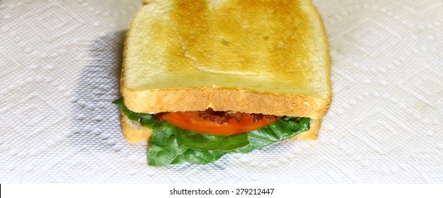 A Fresh Made Bacon Lettuce And Tomato Sandwich Served On A Paper Towel Using Selective Focus On The Front Of The Sandwich With A Shallow Depth Of Field