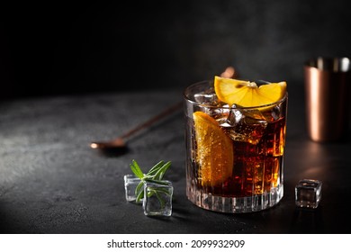 Fresh made Cuba Libre cocktail with brown rum, cola and lemon on wooden background - Shutterstock ID 2099932909
