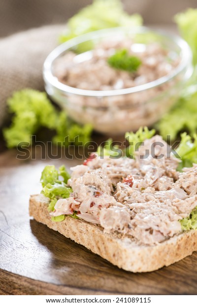 Fresh made Tuna salad sandwich on rustic\
wooden background