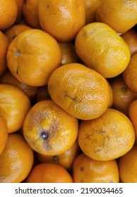 Fresh Mandarin Oranges . Mass Pile Of Orange Mandarin.