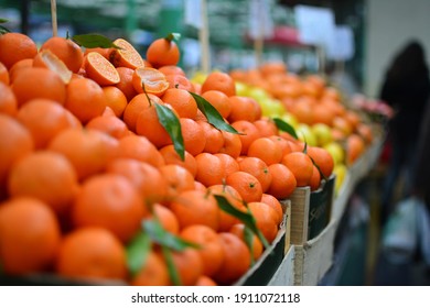 Fresh Mandarin Oranges Or Tangerines Fruit With Leaves In Boxes At The Open Air Local Food Market. Wholesale Depot Of Exotic Fruits. Local Produce At The Farmers Market.