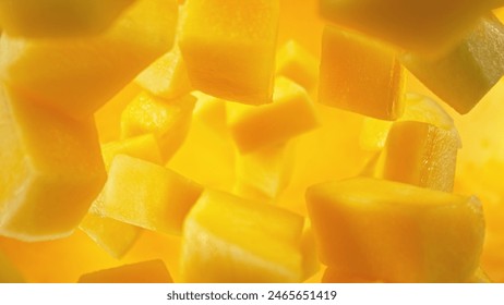 Fresh mango pieces falling into water, top down view - Powered by Shutterstock