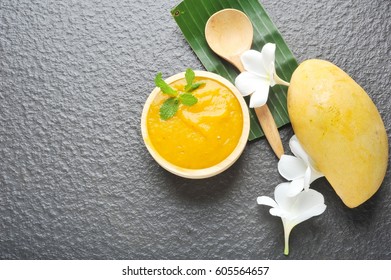 Fresh Mango Smoothie Bowl On Black Background