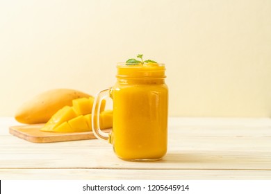 fresh mango smoothies - healthy food and drink concept