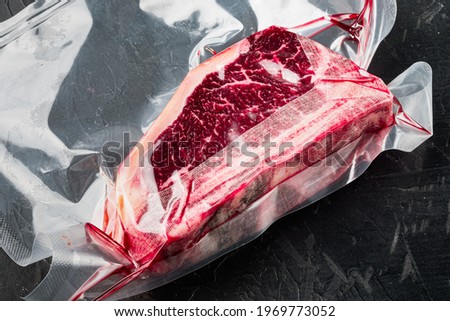 Similar – Dry aged raw tomahawk beef steak isolated on white background