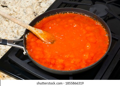 Fresh Marinara Spagetti Sauce With Spices Simmering On A Gas Stove Before Being Added To The Pasta.
