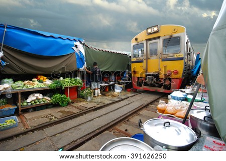 Fresh market on the railroad track, Mae Klong train station, Thailand