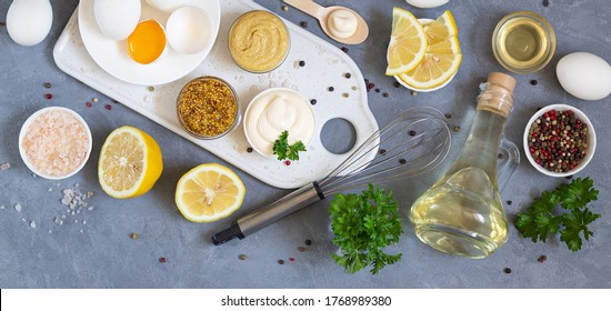 Fresh Mayonnaise With Ingredients And Whisk Overhead On The Stone Table