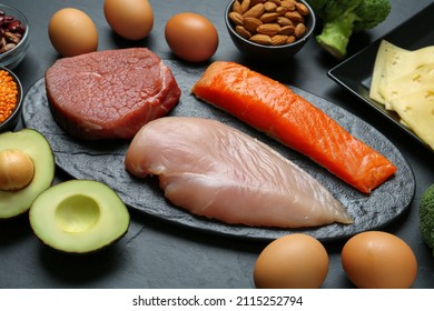 Fresh Meat And Other Products On Black Table. Sources Of Essential Amino Acids