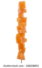 Fresh Melon Cubes On A Bamboo Skewer