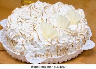 Fresh Meringue Cake On The Wooden Table