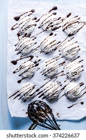 Fresh Meringue Decorated With Chocolate On Baking Tray, Overhead View. Traditional And Simple Baking At Home.