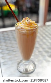 Fresh Milk Caramel Shake, Soft Yellow Color, Smooth Texture, Sweet Taste. In A Retro Tall Glass With Chocolate Milk Shake Delicious Brown. Sprinkle Small Pieces Of Chocolate