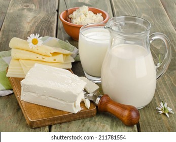 Fresh milk and dairy products on a wooden table. Selective focus - Powered by Shutterstock