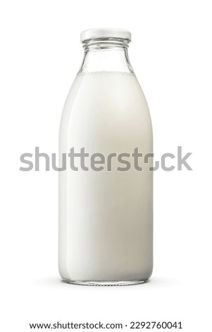Fresh milk a glass bottle with twist off screw cap isolated on white background with clipping path.
