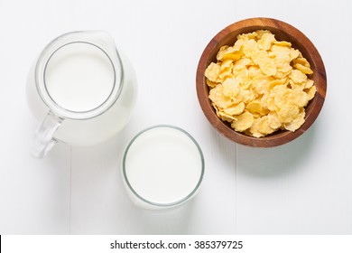 Fresh Milk In Glasses Bottle With Cornflakes, Dairy Produce Concept Of Breakfast On Wood Table Background, Country Rustic Still Life Style, Vintage Tone, Top View. Space For Text.