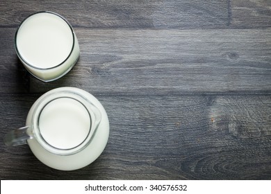 Fresh Milk On Glasses Bottle, Dairy Produce Concept Of Breakfast On Wood Table Background, Country Rustic Still Life Style, Vintage Tone, Top View. Space For Text.