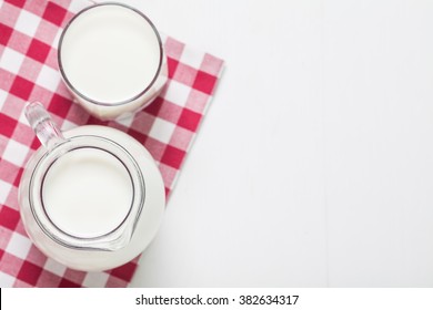 Fresh Milk On Glasses Bottle, Dairy Produce Concept Of Breakfast On Wood Table Background, Country Rustic Still Life Style, Vintage Tone, Top View. Space For Text.