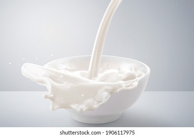 Fresh Milk Pouring In Bowl With Splash. Isolated On Grey And White Background.